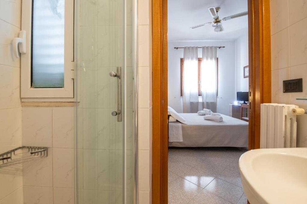 Posteľ alebo postele v izbe v ubytovaní Piccolo Hotel Villa Rosa