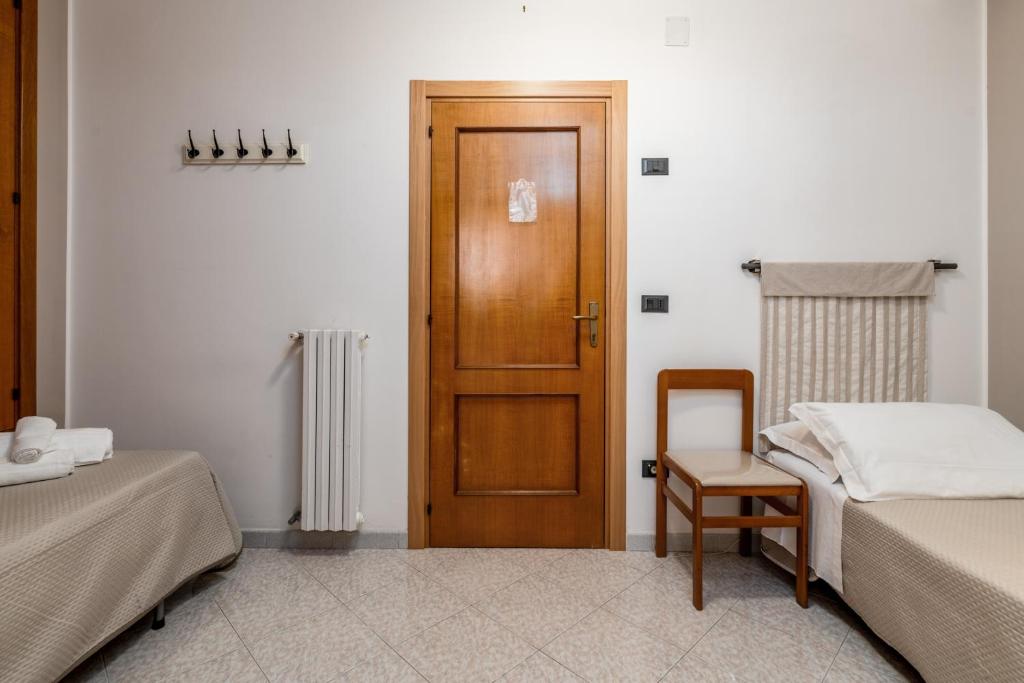 Posteľ alebo postele v izbe v ubytovaní Piccolo Hotel Villa Rosa
