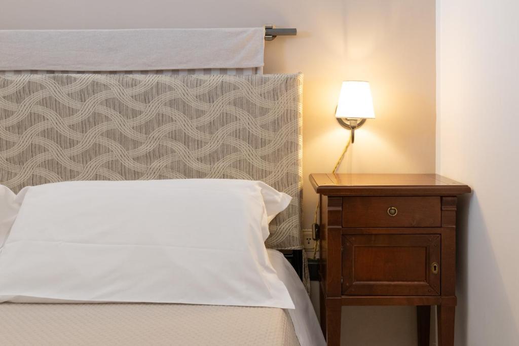 Posteľ alebo postele v izbe v ubytovaní Piccolo Hotel Villa Rosa
