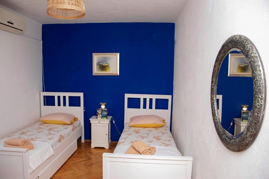 Łóżko lub łóżka w pokoju w obiekcie Tanya-Apartments and Rooms