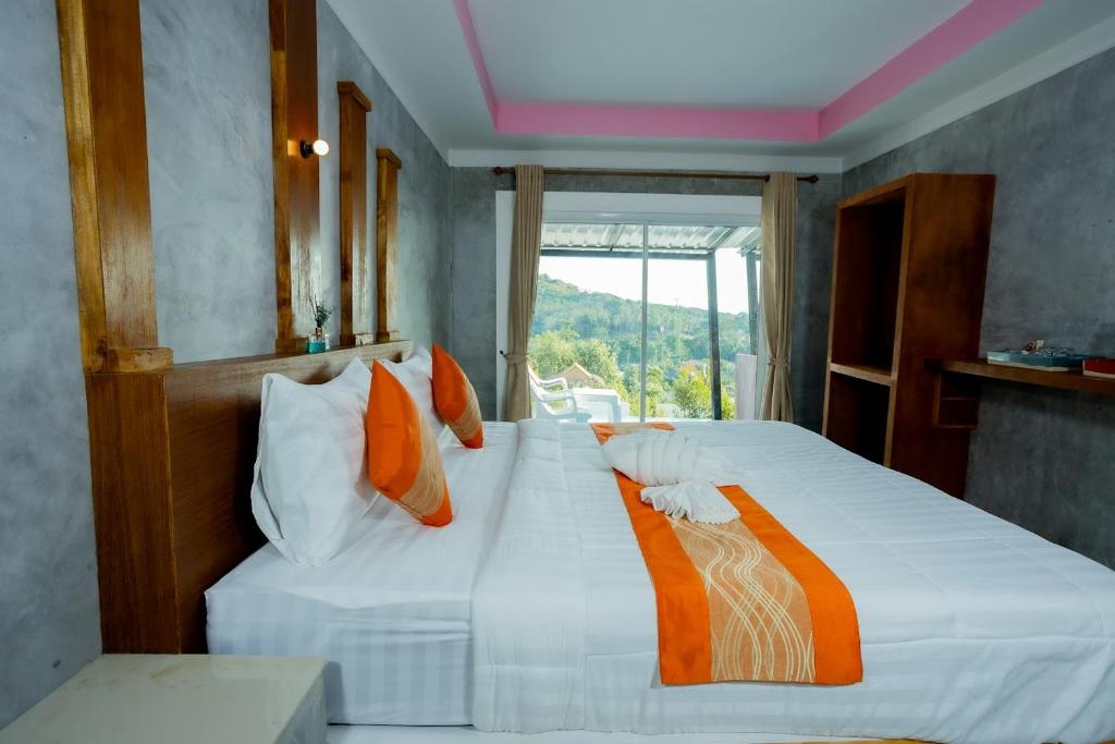 Ένα ή περισσότερα κρεβάτια σε δωμάτιο στο Phulanta Resort