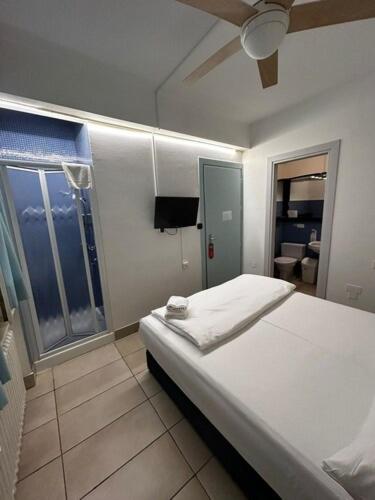 Vuode tai vuoteita majoituspaikassa Hotel San Carlo