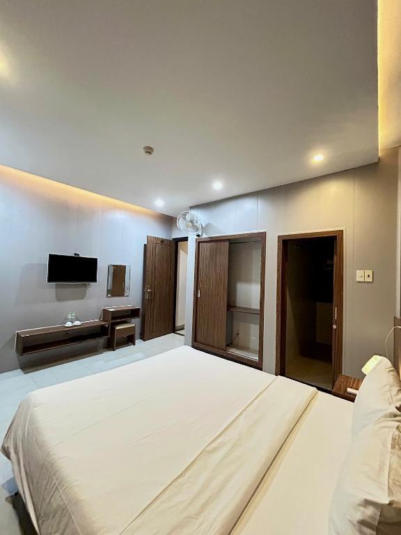 Postel nebo postele na pokoji v ubytování BeSea Hotel