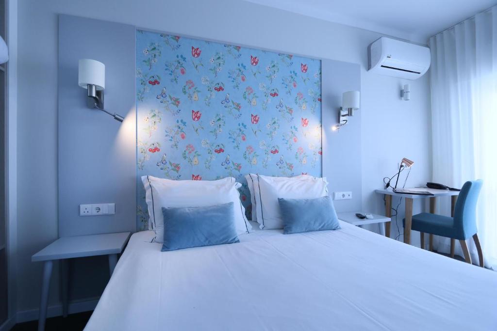Кровать или кровати в номере Agua Hotels Alvor Jardim