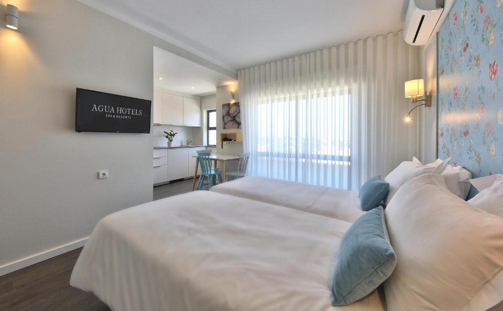 Кровать или кровати в номере Agua Hotels Alvor Jardim