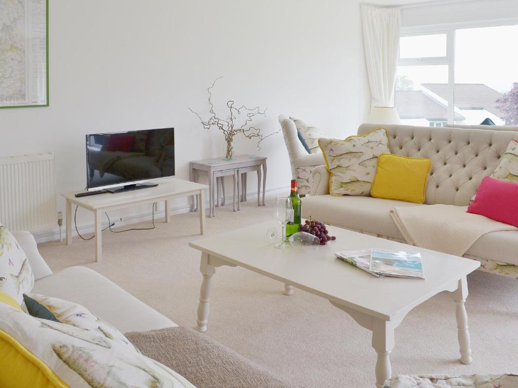 a living room with a couch and a coffee table at Tamar Ten in Gunnislake