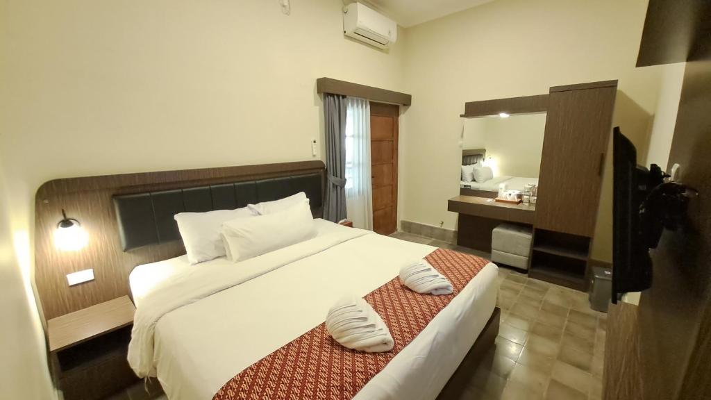 Yuwono Hotel & Villa Malioboro客房内的一张或多张床位