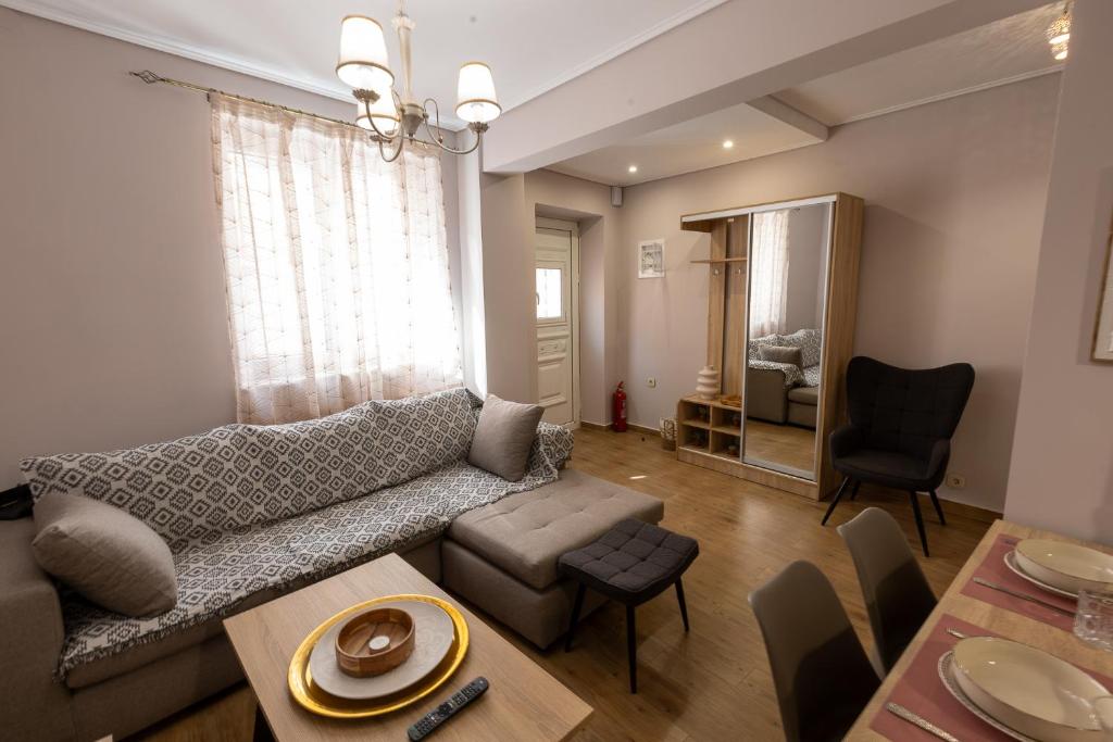 a living room with a couch and a table at Brand new detached house in central Mytilene in Mytilini