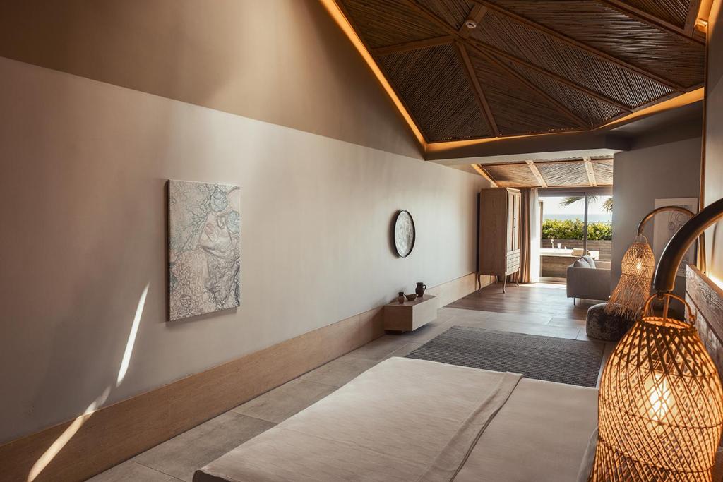 A bed or beds in a room at Day One Beach Resort & SPA - Adult Only