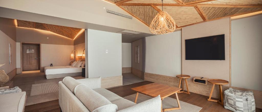 A television and/or entertainment centre at Day One Beach Resort & SPA - Adult Only