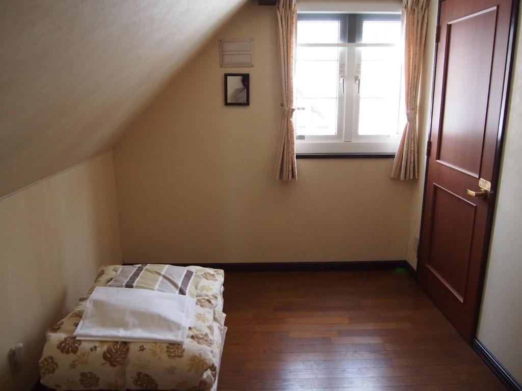 Postel nebo postele na pokoji v ubytování Guesthouse Canterbury