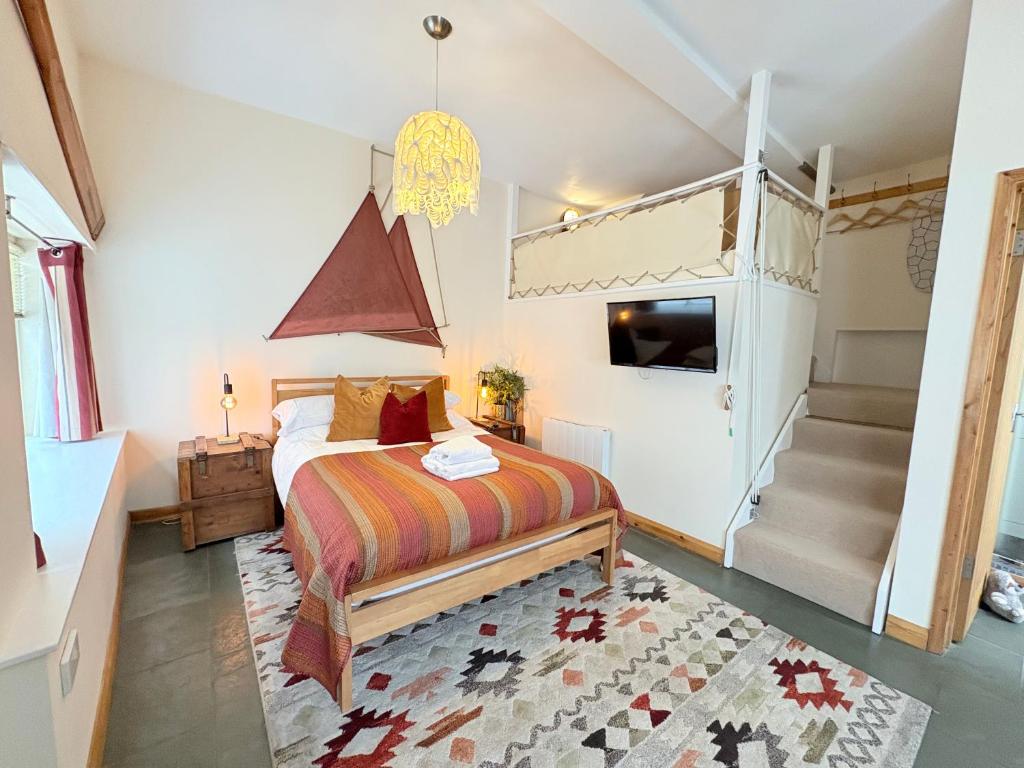 a bedroom with a bed and a bunk bed at Zion Place in Dartmouth