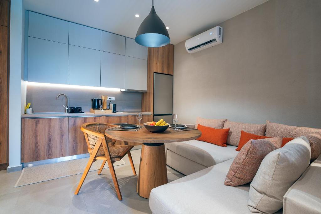 a living room with a table and a couch at Stylish Suite in Rhodes Town