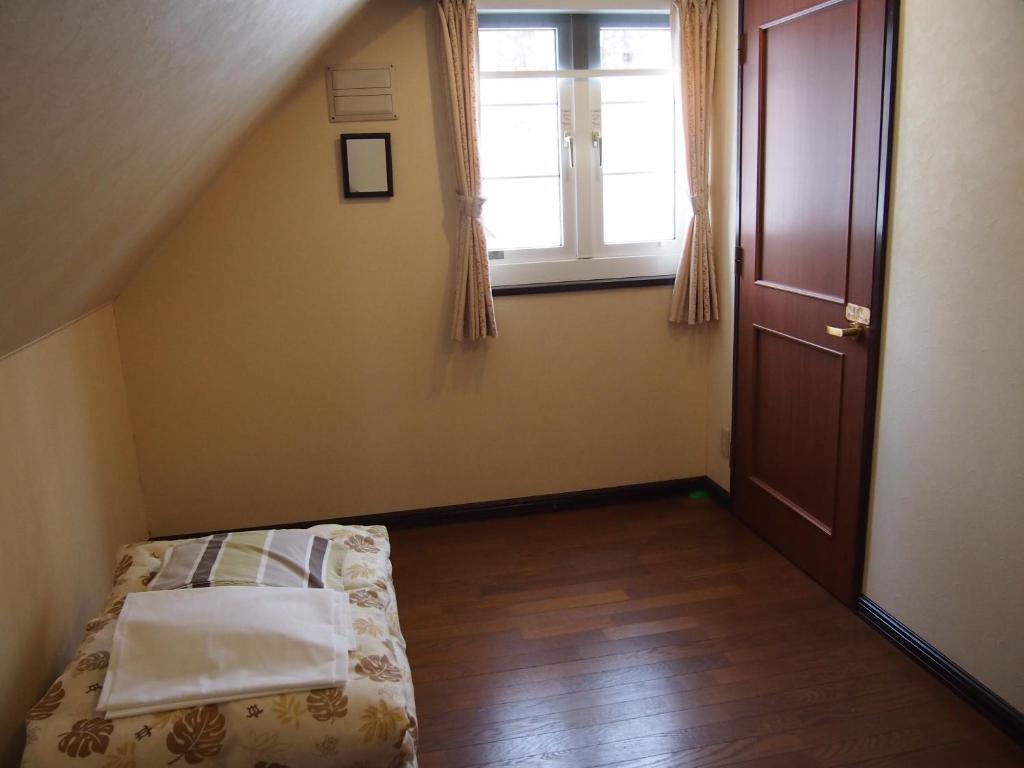 Postel nebo postele na pokoji v ubytování Guesthouse Canterbury