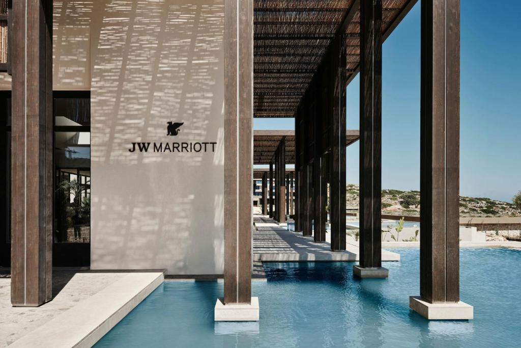 a building with a sign on the side of it at JW Marriott Crete Resort & Spa in Marathi