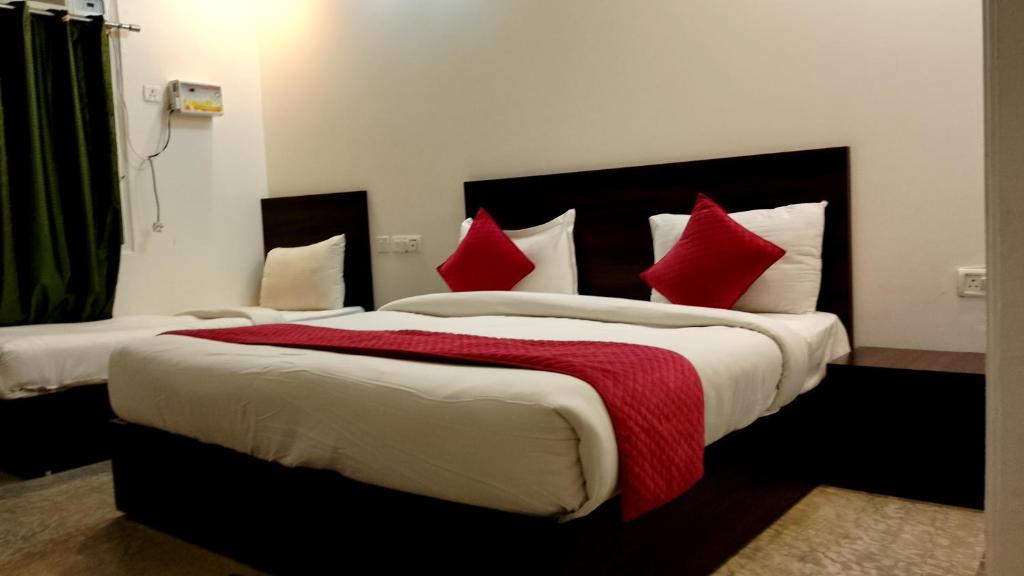 Postel nebo postele na pokoji v ubytování Hotel Rakesh