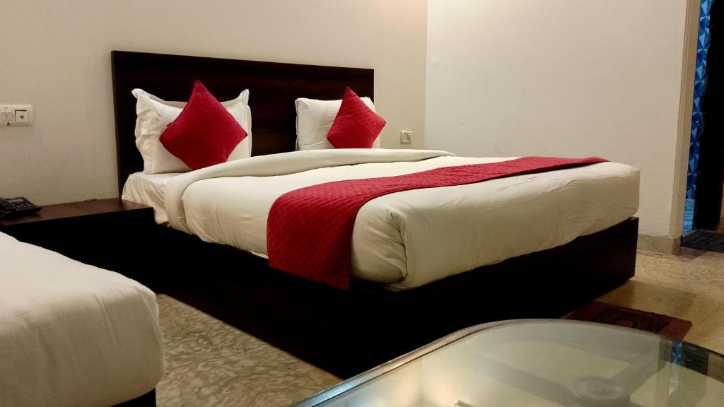 Postel nebo postele na pokoji v ubytování Hotel Rakesh