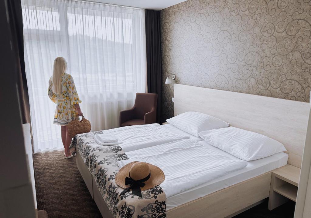 Postel nebo postele na pokoji v ubytování Hotel Magnólia