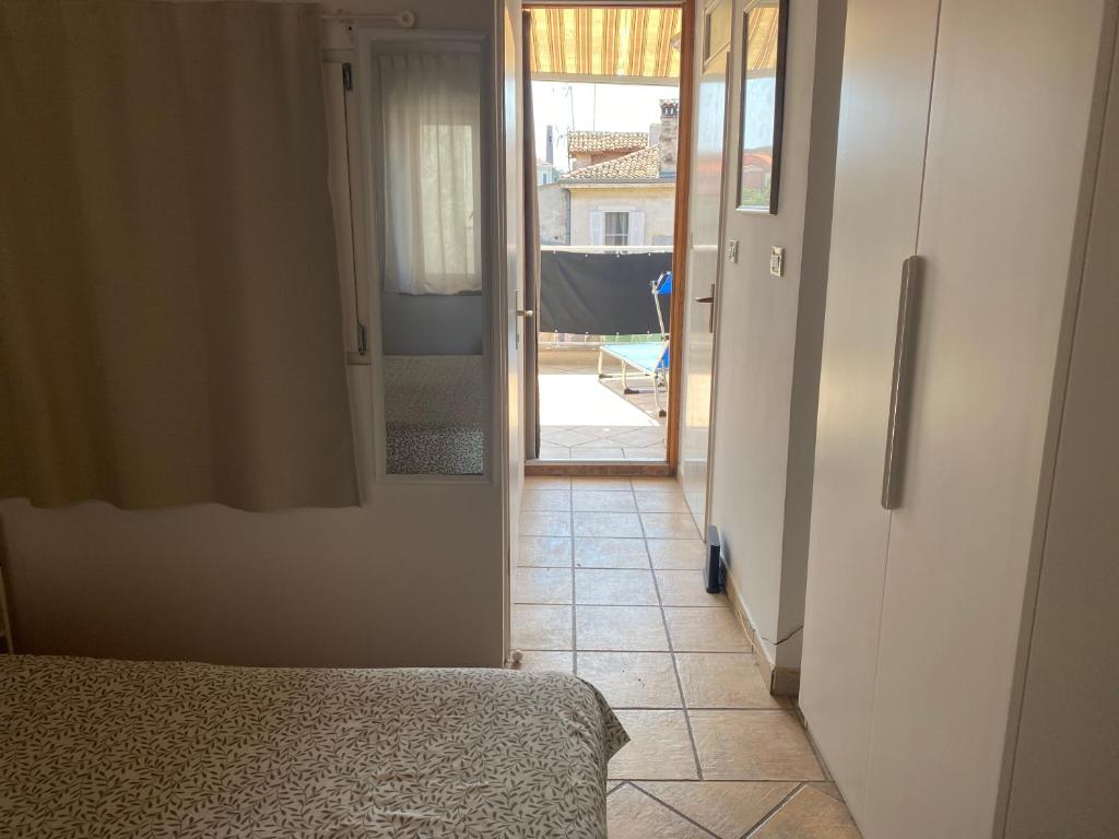 a hallway with a door leading to a room at Guest House Marta in Rovinj
