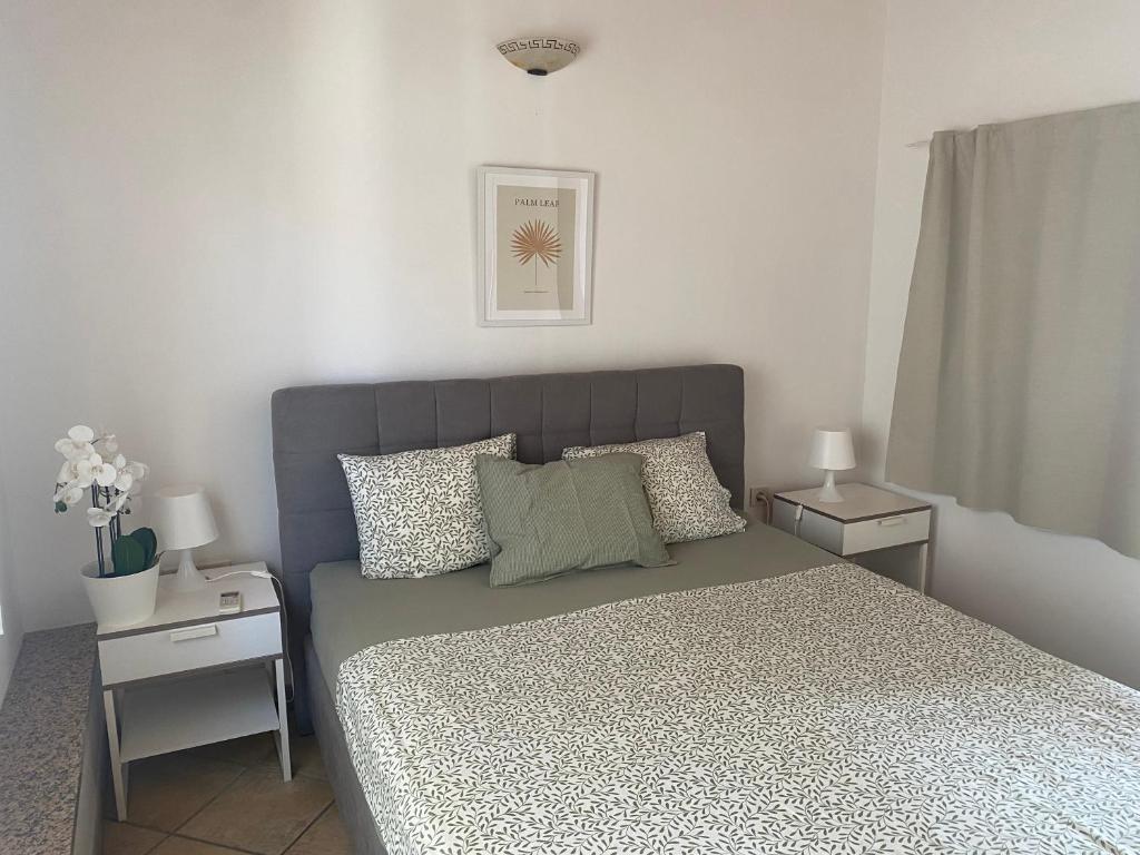 a bedroom with a large bed with two night stands at Guest House Marta in Rovinj