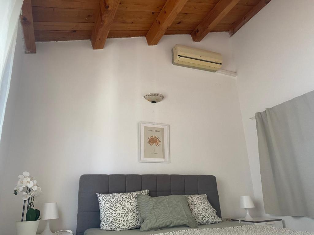 a living room with a couch and a ceiling at Guest House Marta in Rovinj