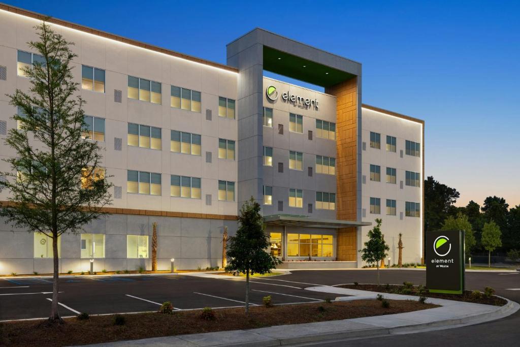 an office building with a parking lot in front of it at Element Charleston Airport in Charleston