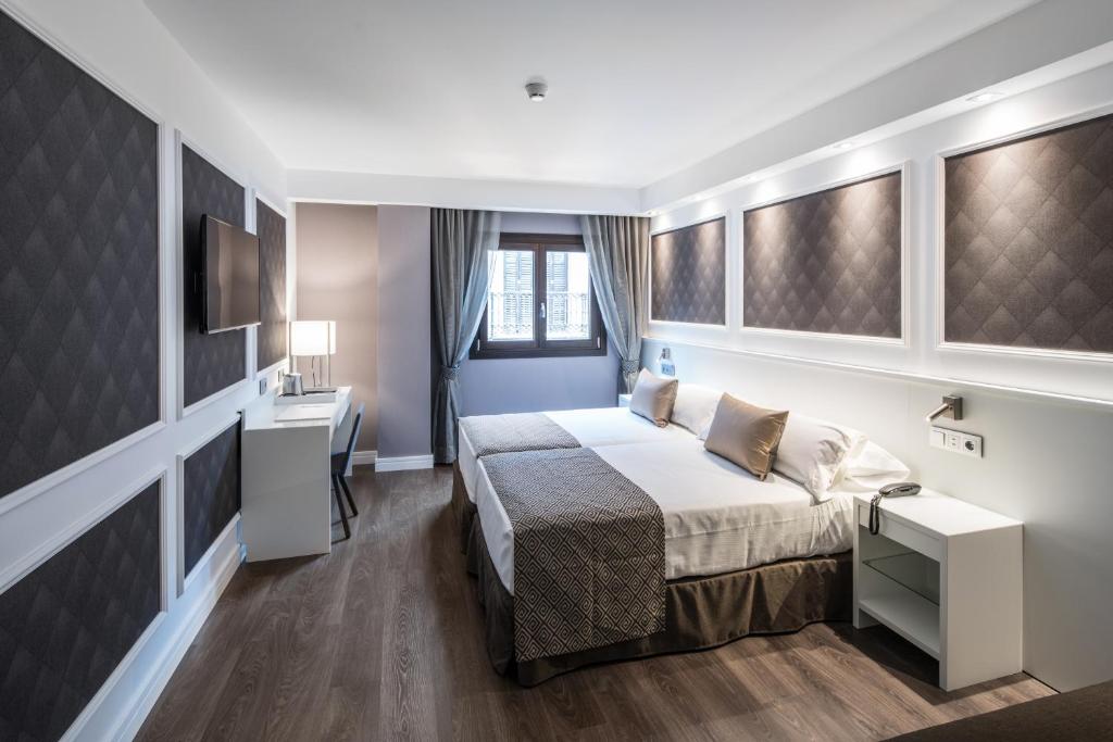 Cama o camas de una habitación en Catalonia Magdalenes