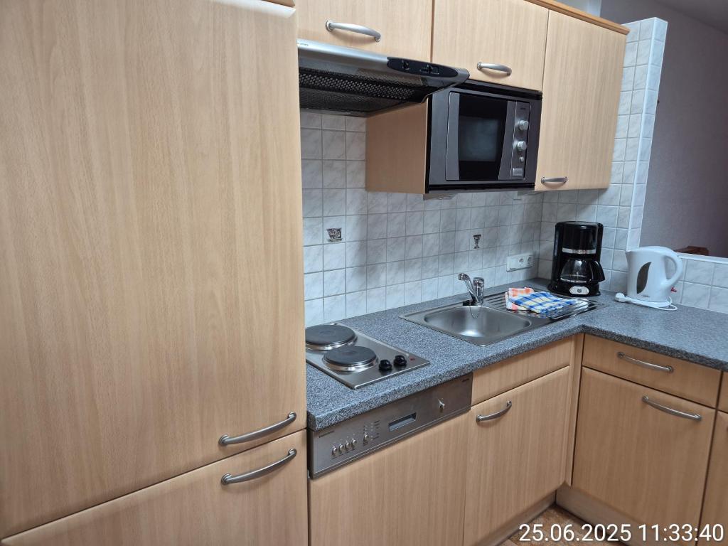 Kuchyňa alebo kuchynka v ubytovaní Das Apartment Rief daheim beim Wanderprofi Adults Only