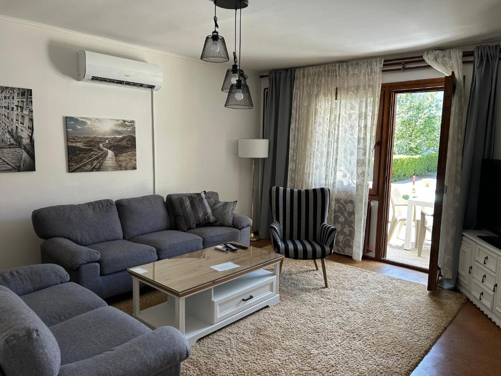 a living room with a couch and a coffee table at domus est alba in Sarajevo