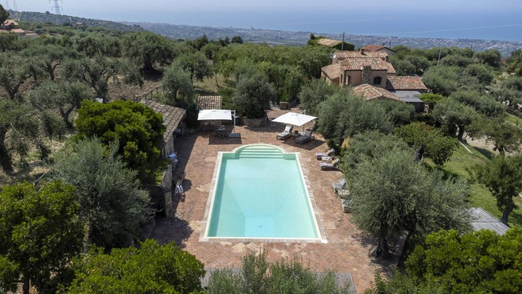 an aerial view of a house with a swimming pool at Villa Passulunara 14 by Massimo Villas in Collesano