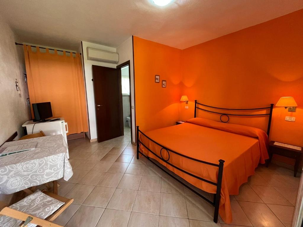 Postel nebo postele na pokoji v ubytování Agriturismo La Carlina