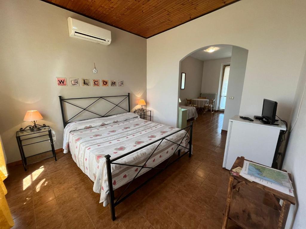 Postel nebo postele na pokoji v ubytování Agriturismo La Carlina