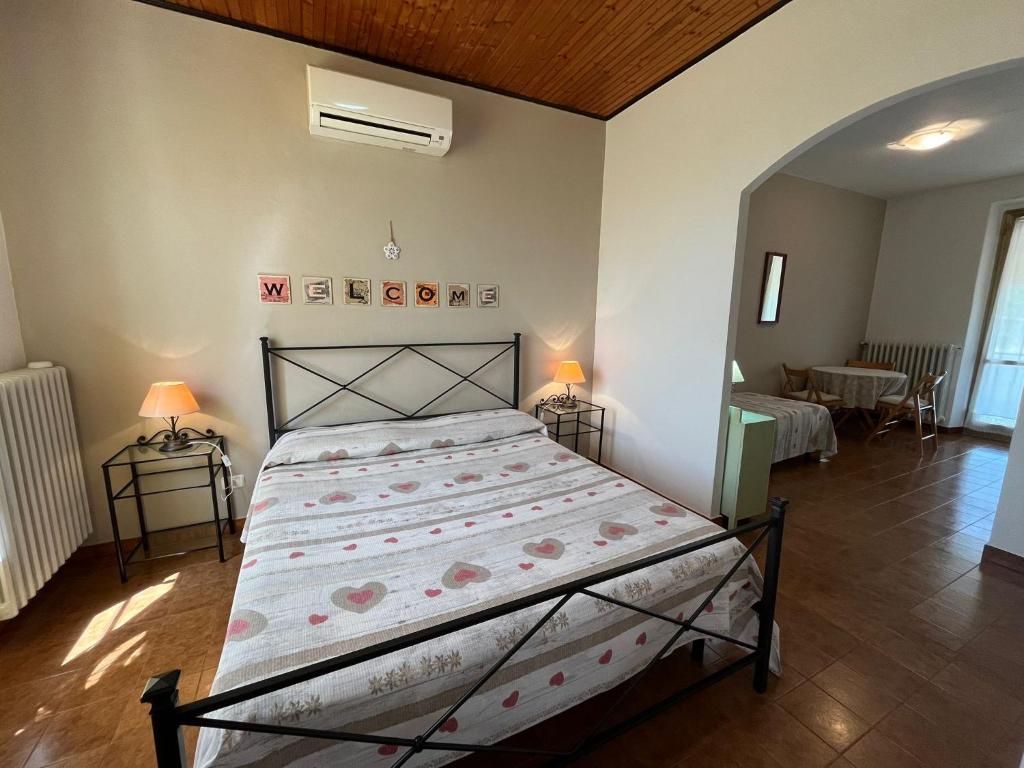 Postel nebo postele na pokoji v ubytování Agriturismo La Carlina