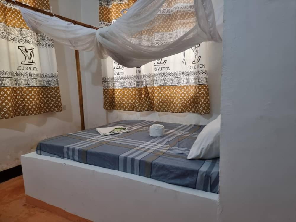 Postel nebo postele na pokoji v ubytování Shalom Homestay