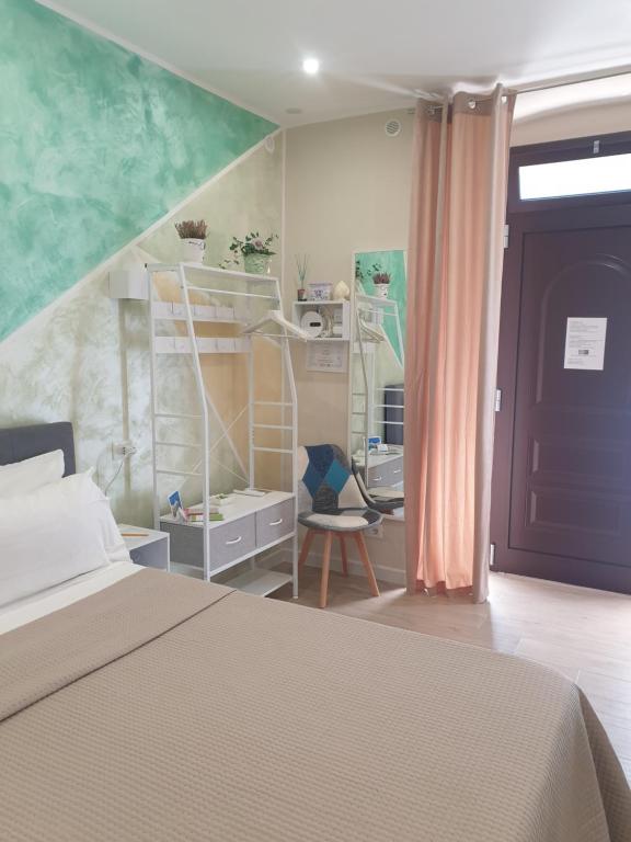 a bedroom with a bed and a book shelf at Corte Verde 5 in Bari