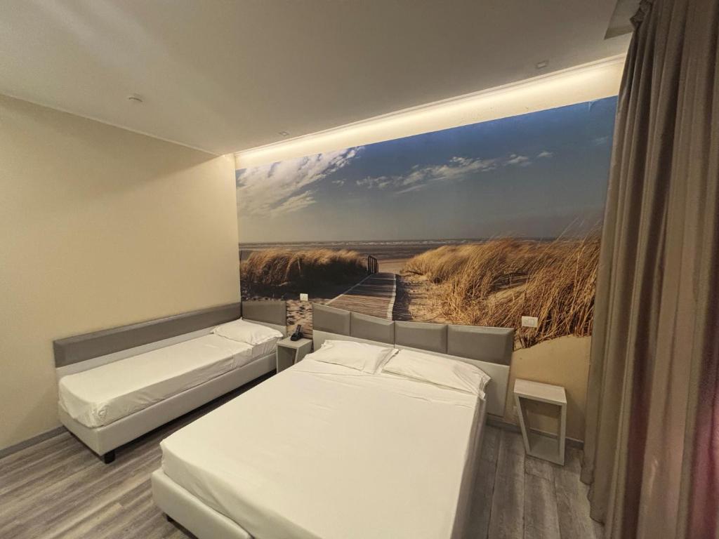 Postel nebo postele na pokoji v ubytování Hotel Fiera Wellness & Spa