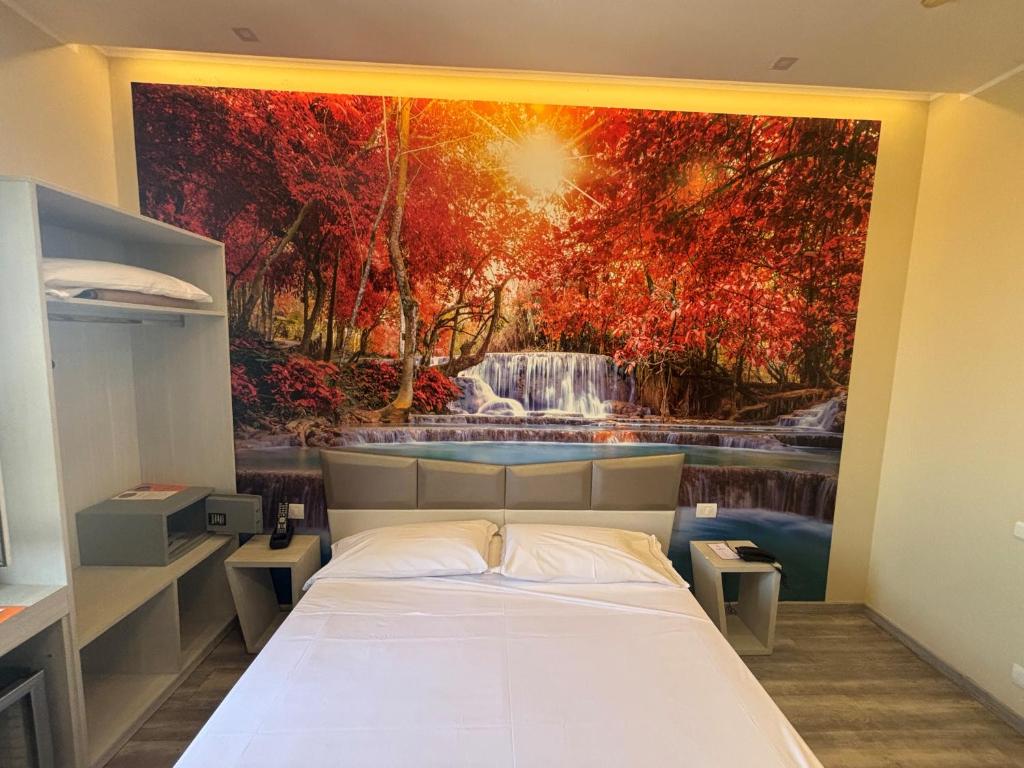 Postel nebo postele na pokoji v ubytování Hotel Fiera Wellness & Spa