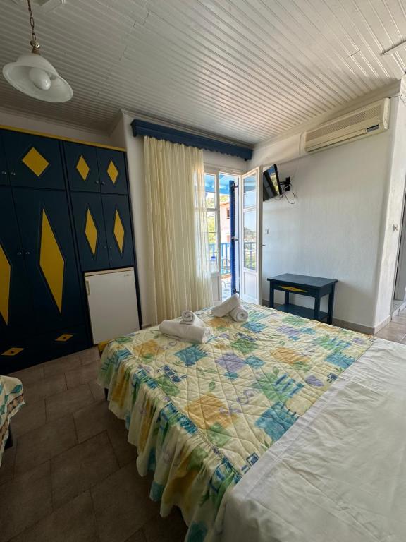 Postel nebo postele na pokoji v ubytování Galini Hellenic Hospitality