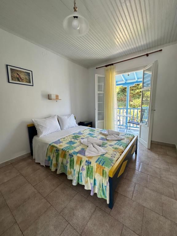 Postel nebo postele na pokoji v ubytování Galini Hellenic Hospitality