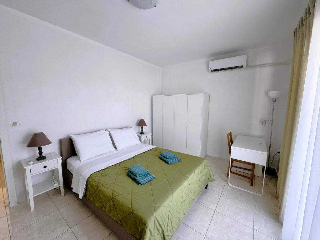 Postel nebo postele na pokoji v ubytování Masefa villa