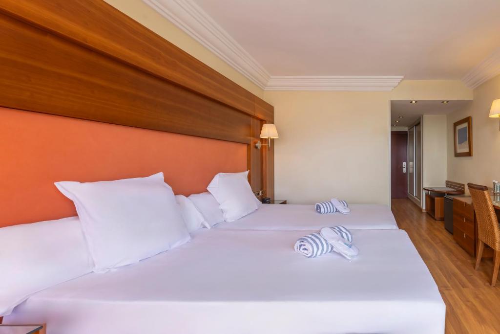 Postel nebo postele na pokoji v ubytování Hotel Moon Dreams Portomagno