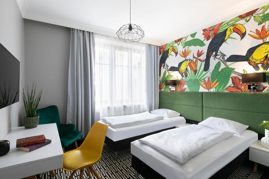 Postel nebo postele na pokoji v ubytování Liv'Inn Aparthotel