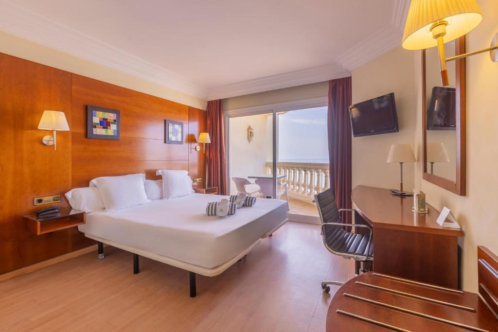 Postel nebo postele na pokoji v ubytování Hotel Moon Dreams Portomagno