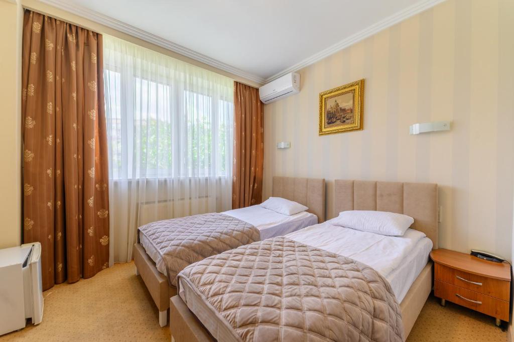 Postel nebo postele na pokoji v ubytování Persian Palace Hotel