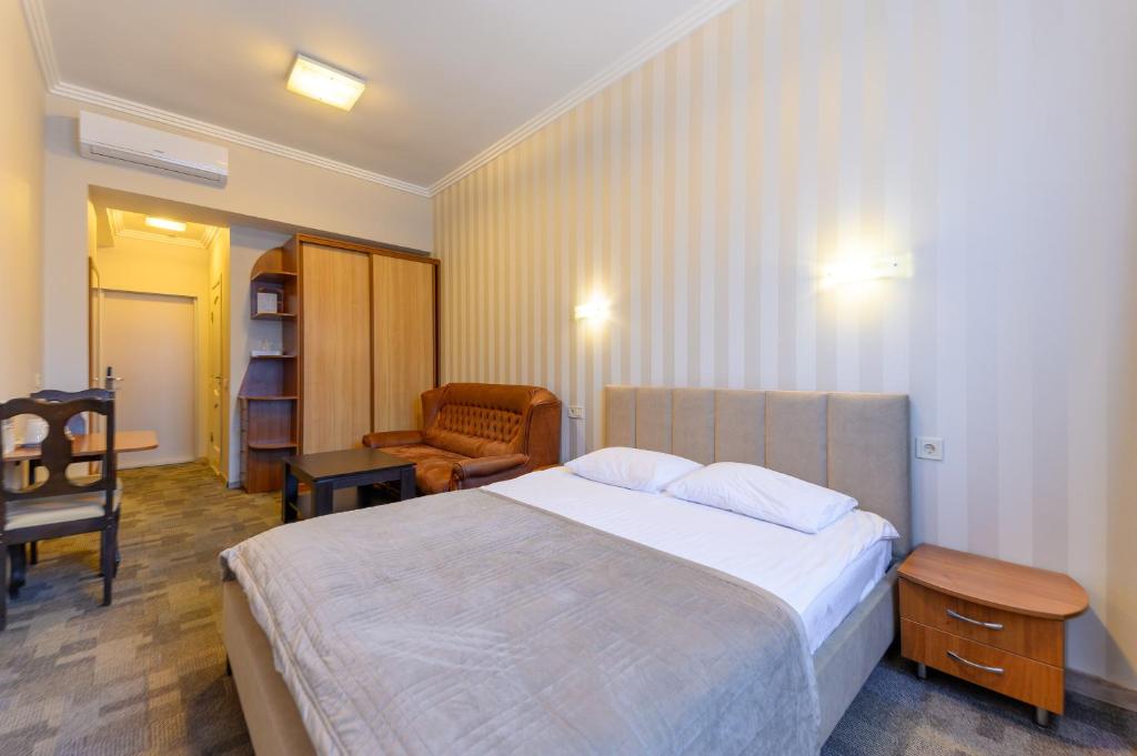 Postel nebo postele na pokoji v ubytování Persian Palace Hotel