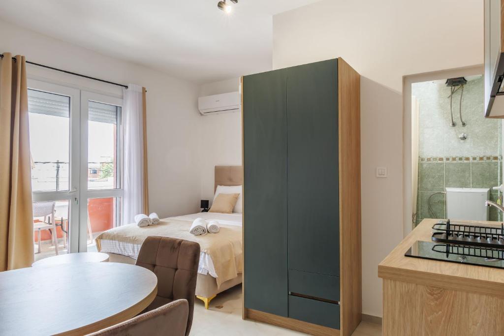 Postel nebo postele na pokoji v ubytování Apartments Donna