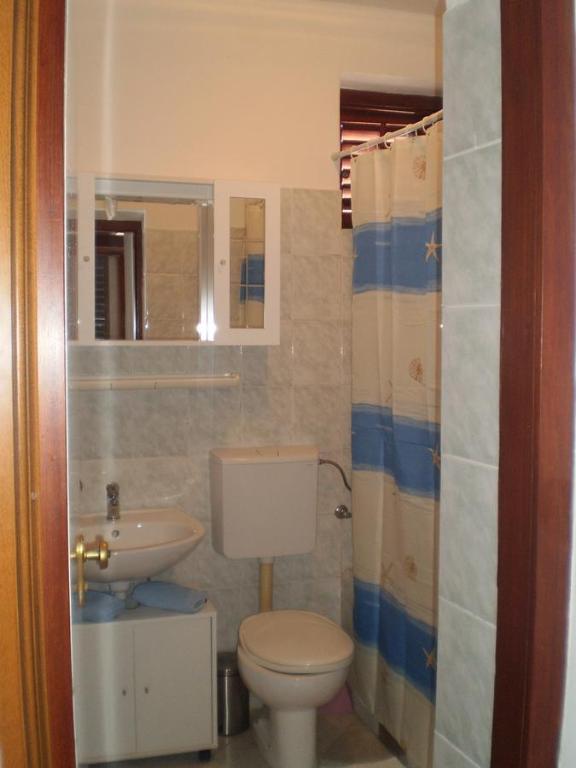 Kúpeľňa v ubytovaní Apartments Kuzman