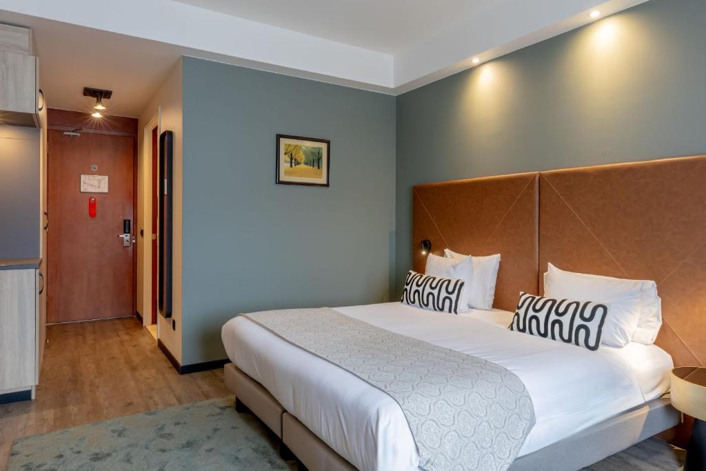 Postel nebo postele na pokoji v ubytování Shanghai Hotel Holland