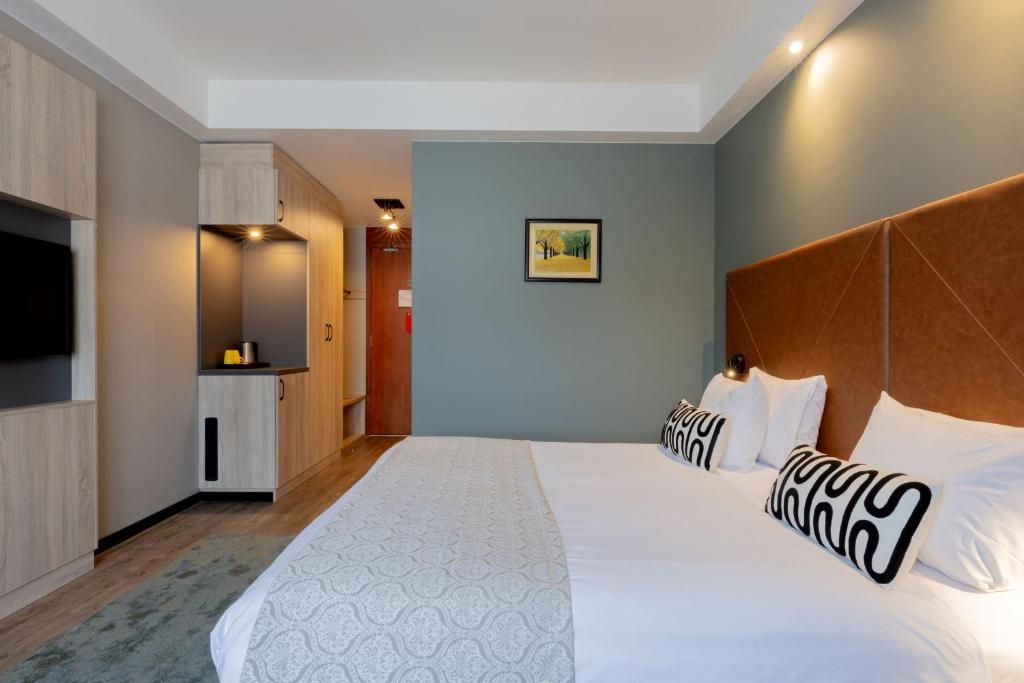 Postel nebo postele na pokoji v ubytování Shanghai Hotel Holland