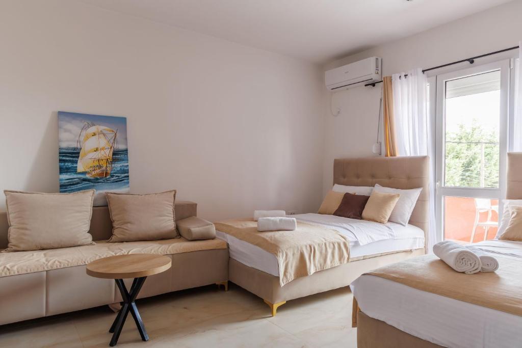 Postel nebo postele na pokoji v ubytování Apartments Donna